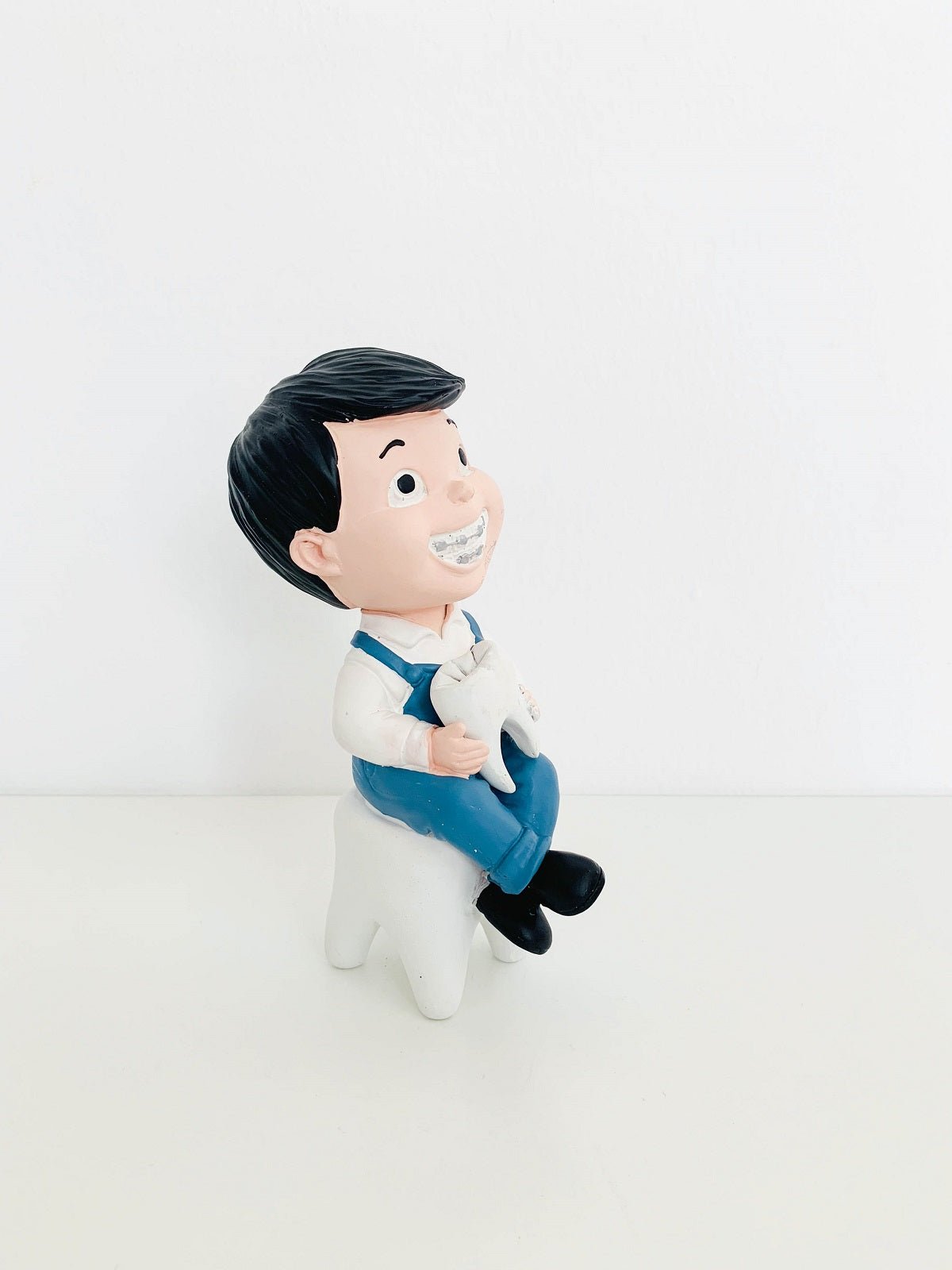 Boy With Tooth Figurine, third view